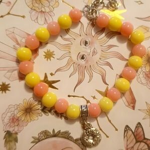 Vibrant Pink and Yellow Beaded Bracelet with Charm